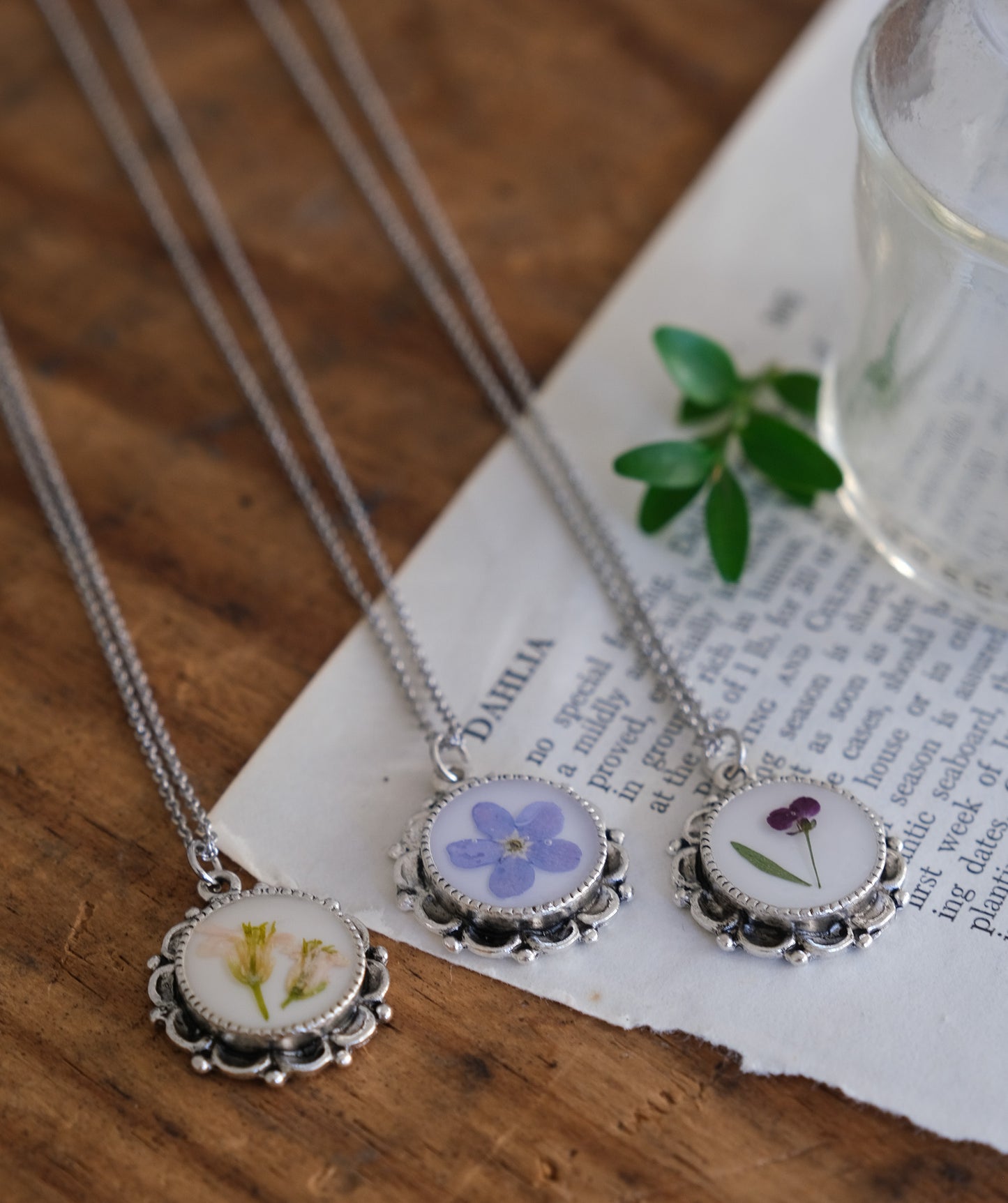Ornate Scalloped Edge Pressed Flower Necklace with White Background