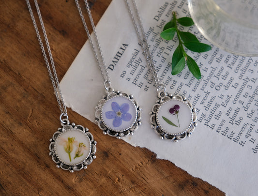 Ornate Scalloped Edge Pressed Flower Necklace with White Background