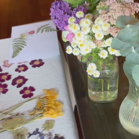 overview of people working at a pressed flower workshop