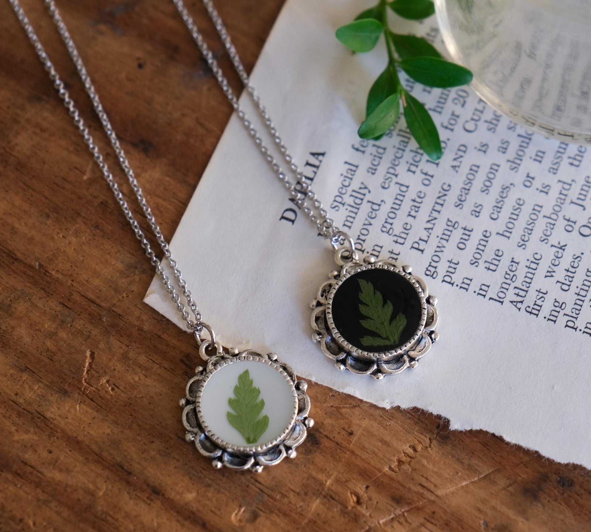 pressed fern necklace in vintage-style ornate silver pendant setting.